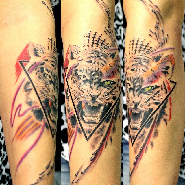 Polka tiger tattoo on lower arm